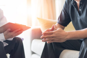 a doctor and a male patient sat down talking