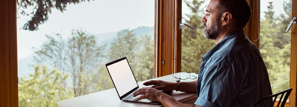 Man on computer researching vasectomy procedure