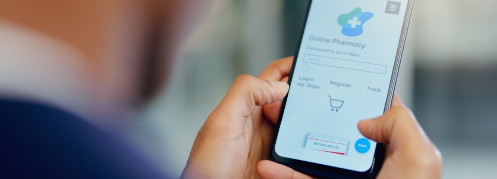 Man looking at online pharmacy screen on phone